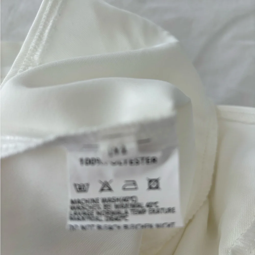 New without tags off-white jumpsuit. Size medium.‎